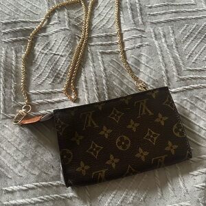 Louis Vuitton pochette with coa